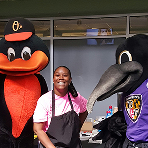 Robin Holmes and the O's and Ravens mascots