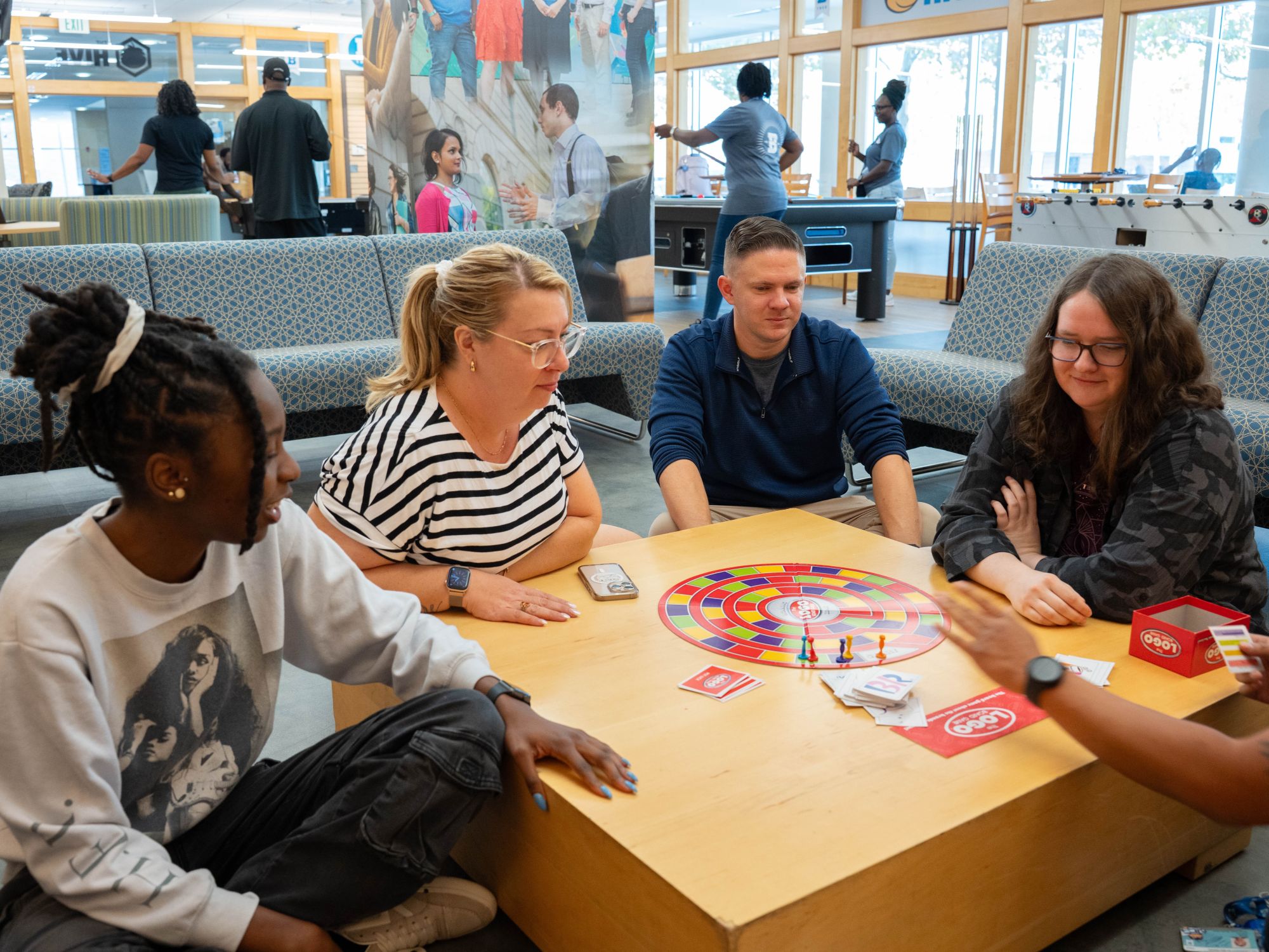 UBalt community members playing a board game.