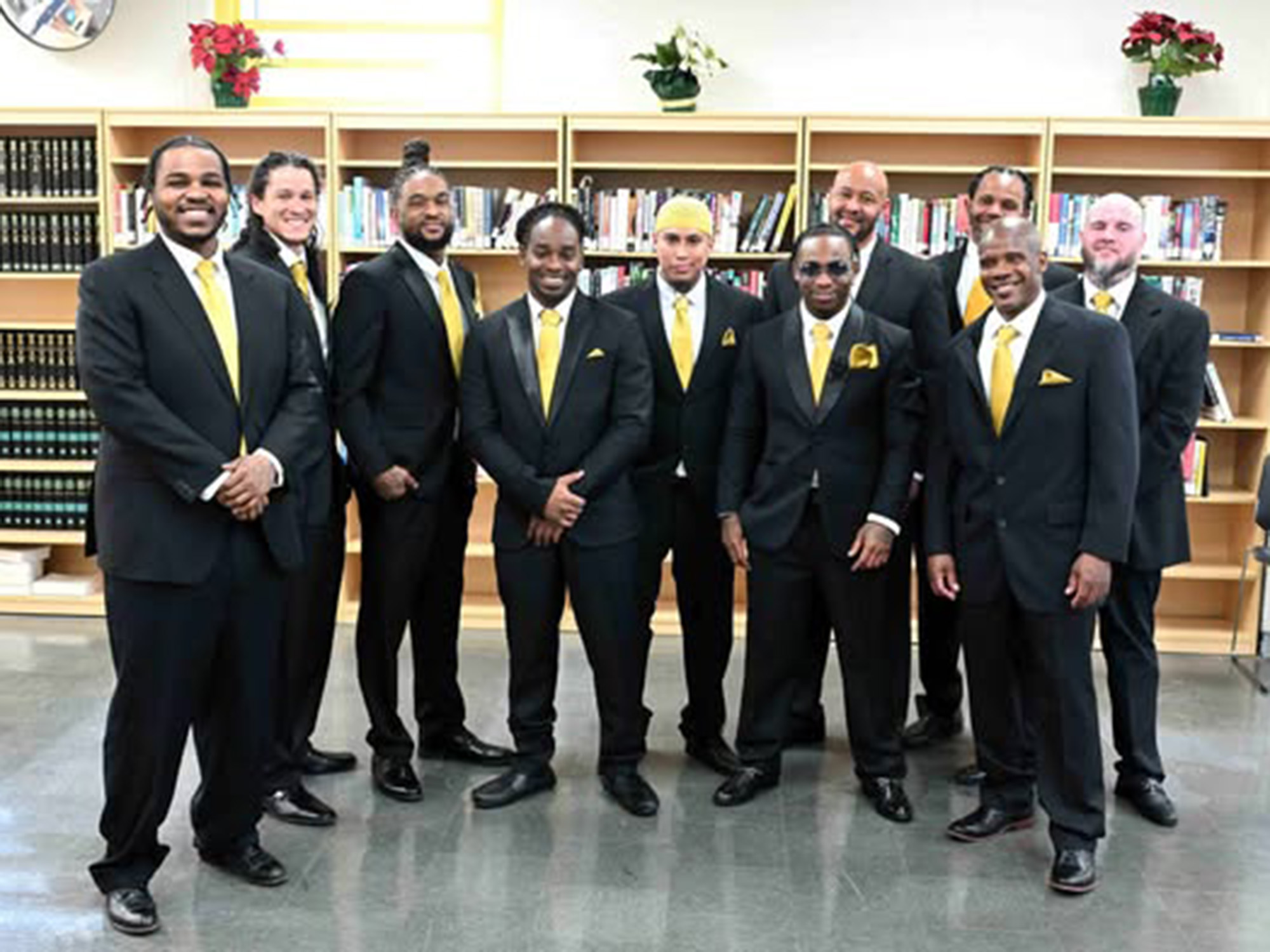 Incarcerated men pictured at the Jessup Correctional Institute prepare for the Father Dance