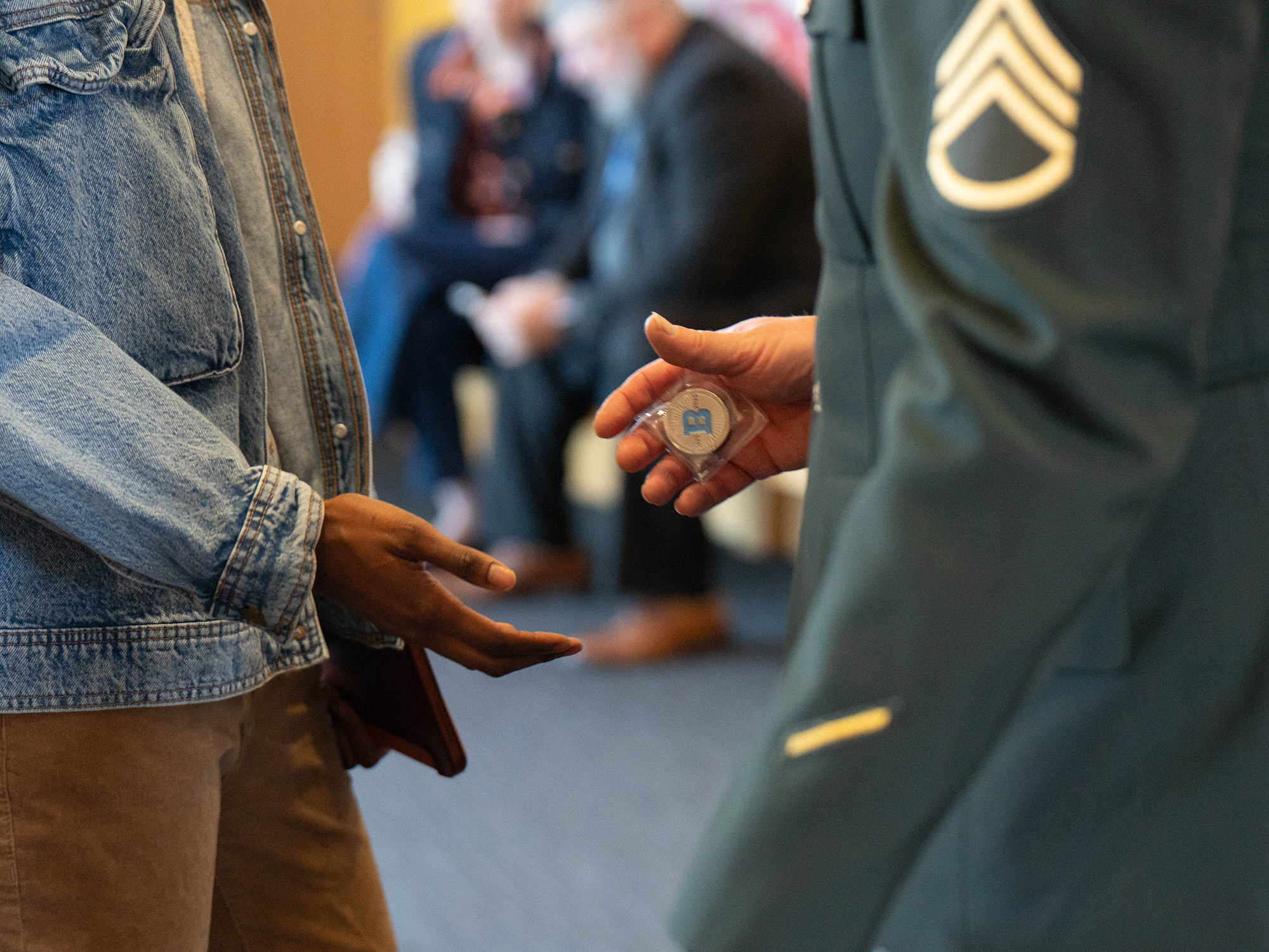 Veterans shake hands at University of Baltimore Veterans Day event 