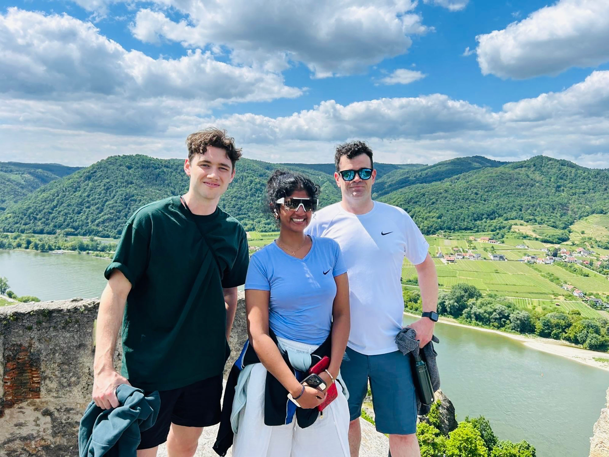 Three students pose in Austria.
