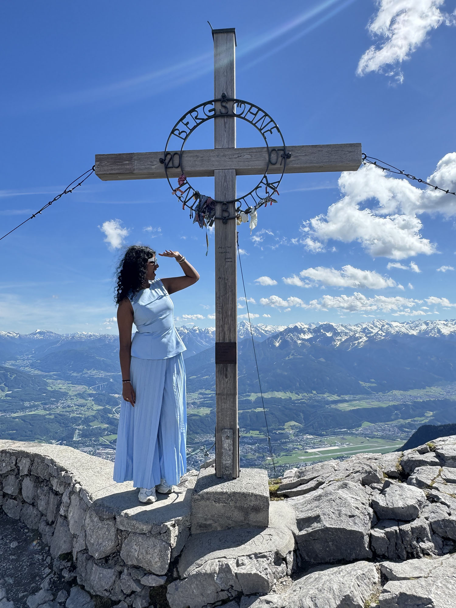 Sabrina poses on top of the mountain in Innsbruck