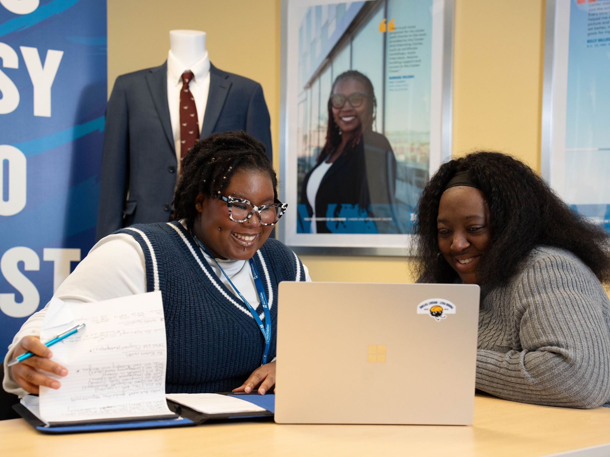 A student meets with a career adviser in the career center on UBalt's campus.