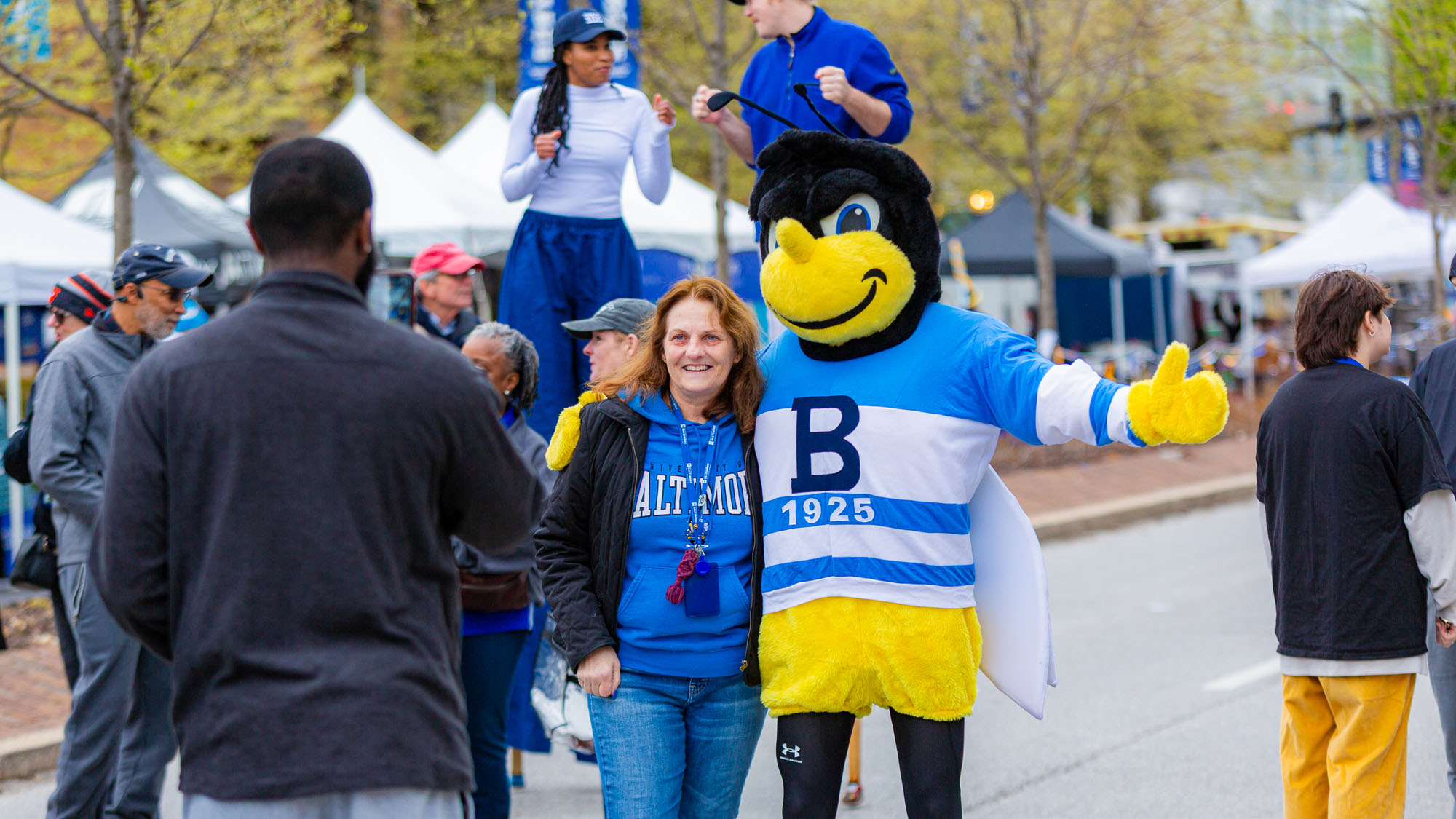 Eubie poses with a guest of the Centennial Rock the Block in April. 