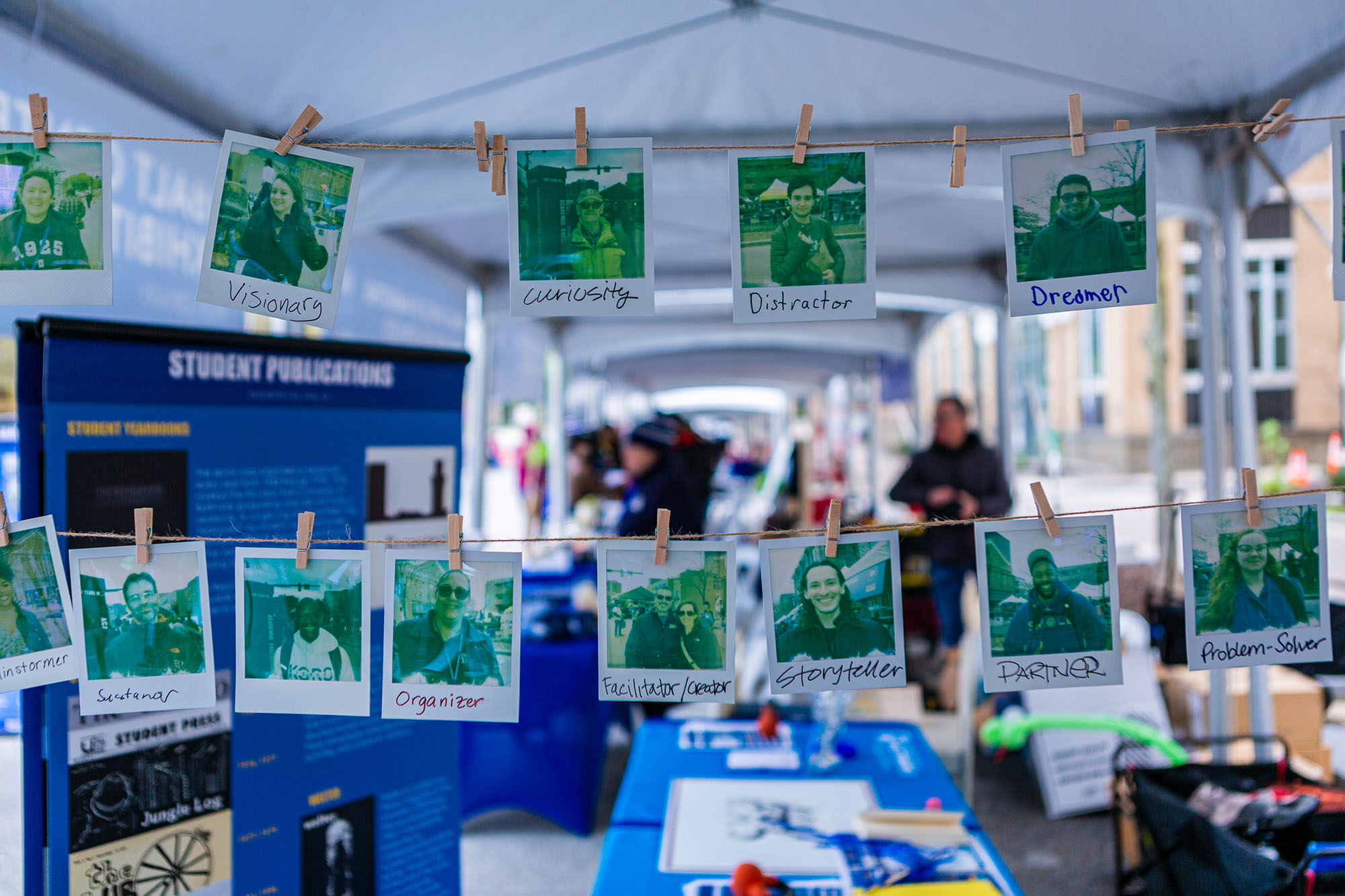 Photos are displayed on a clothes line as they develop.