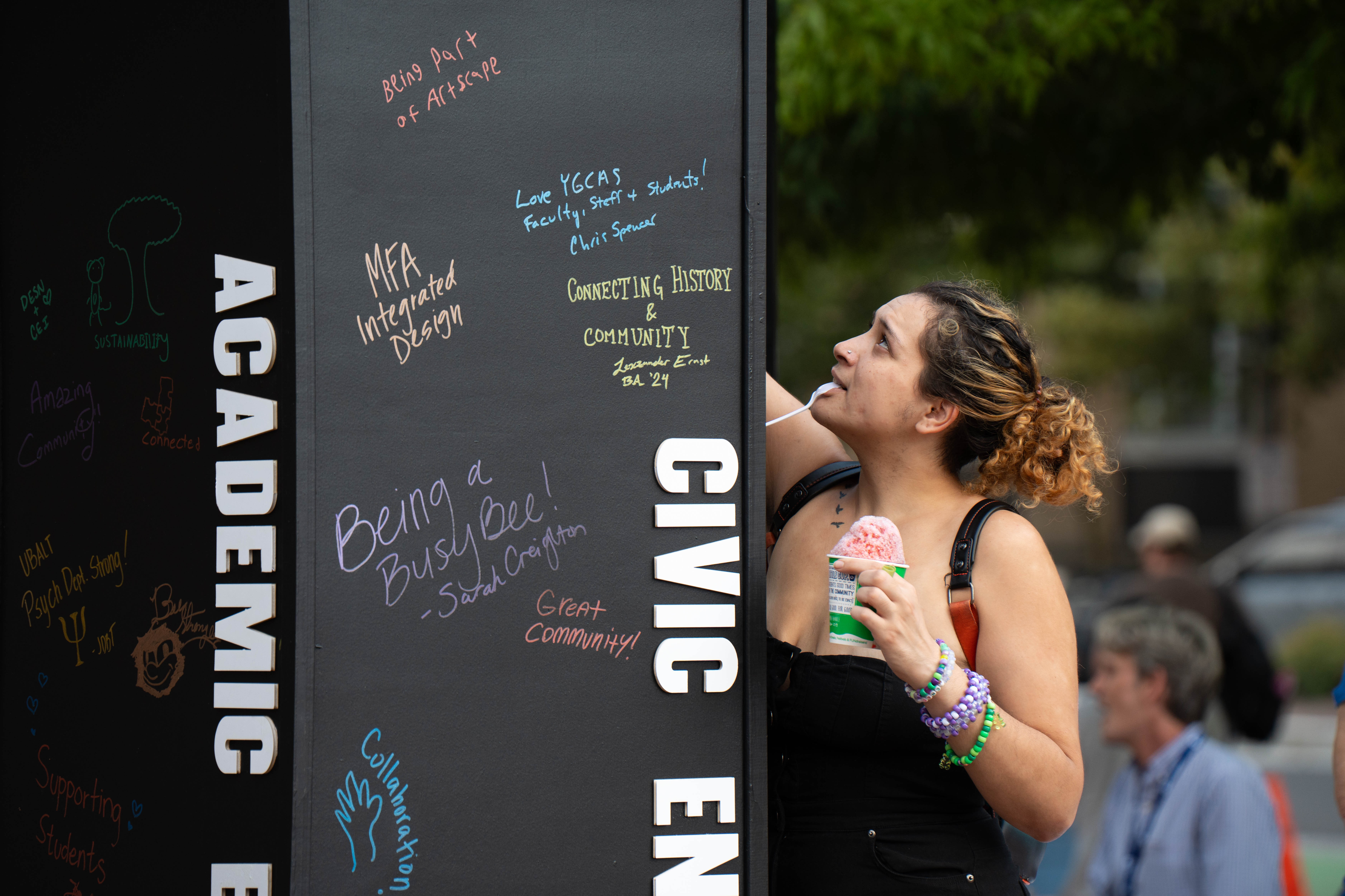 A wooden box offers space for people to write their memories.