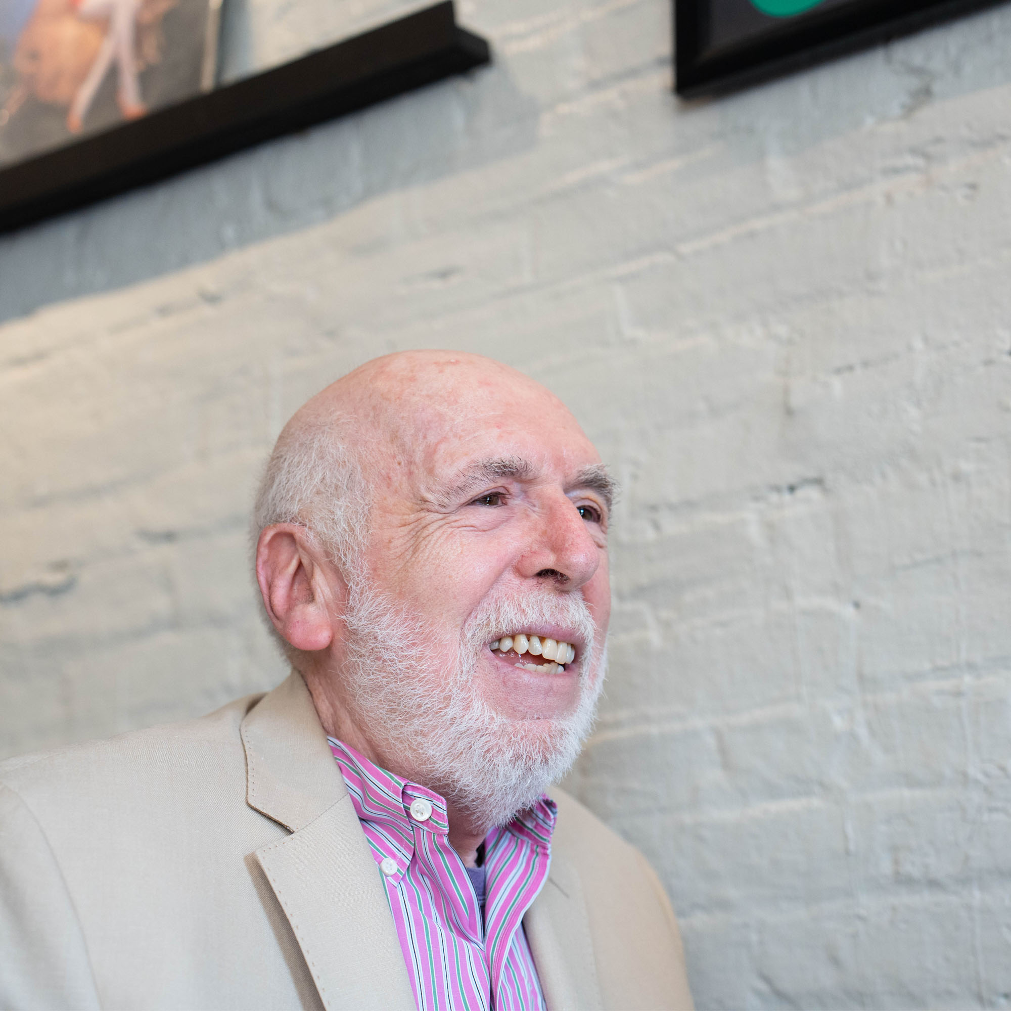 Joseph Adler smiles while looking off screen. 