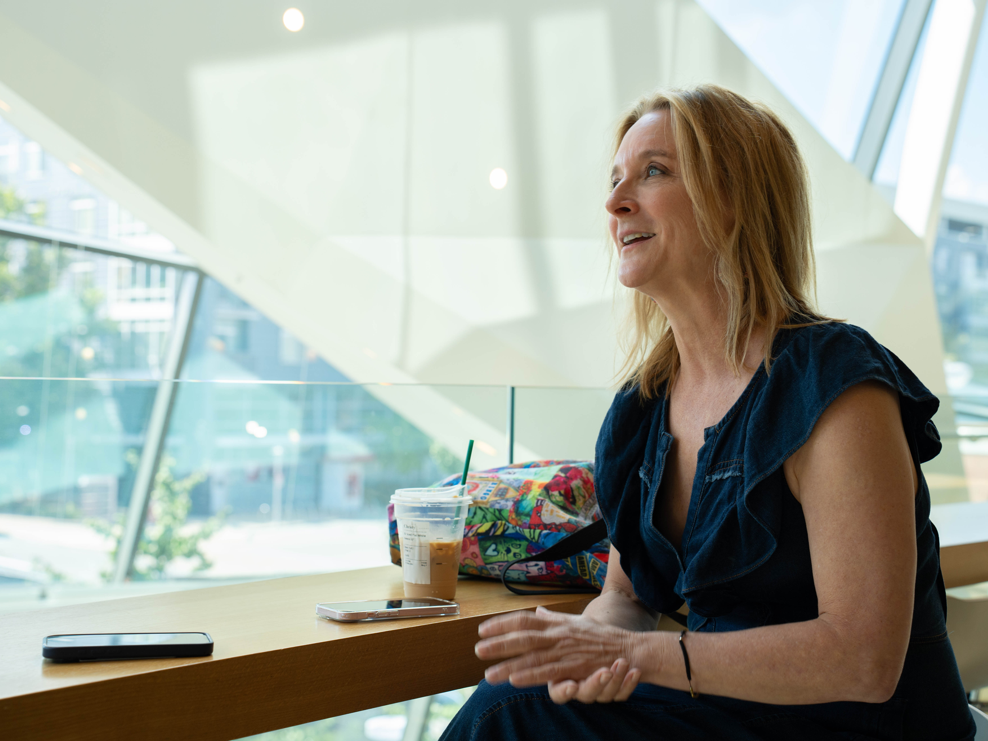 Kimberly Wehle tells a story while sitting in the library.