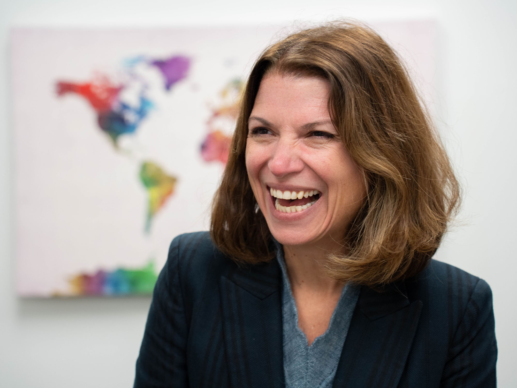 Jennica Larrison laughs during an interview in her office