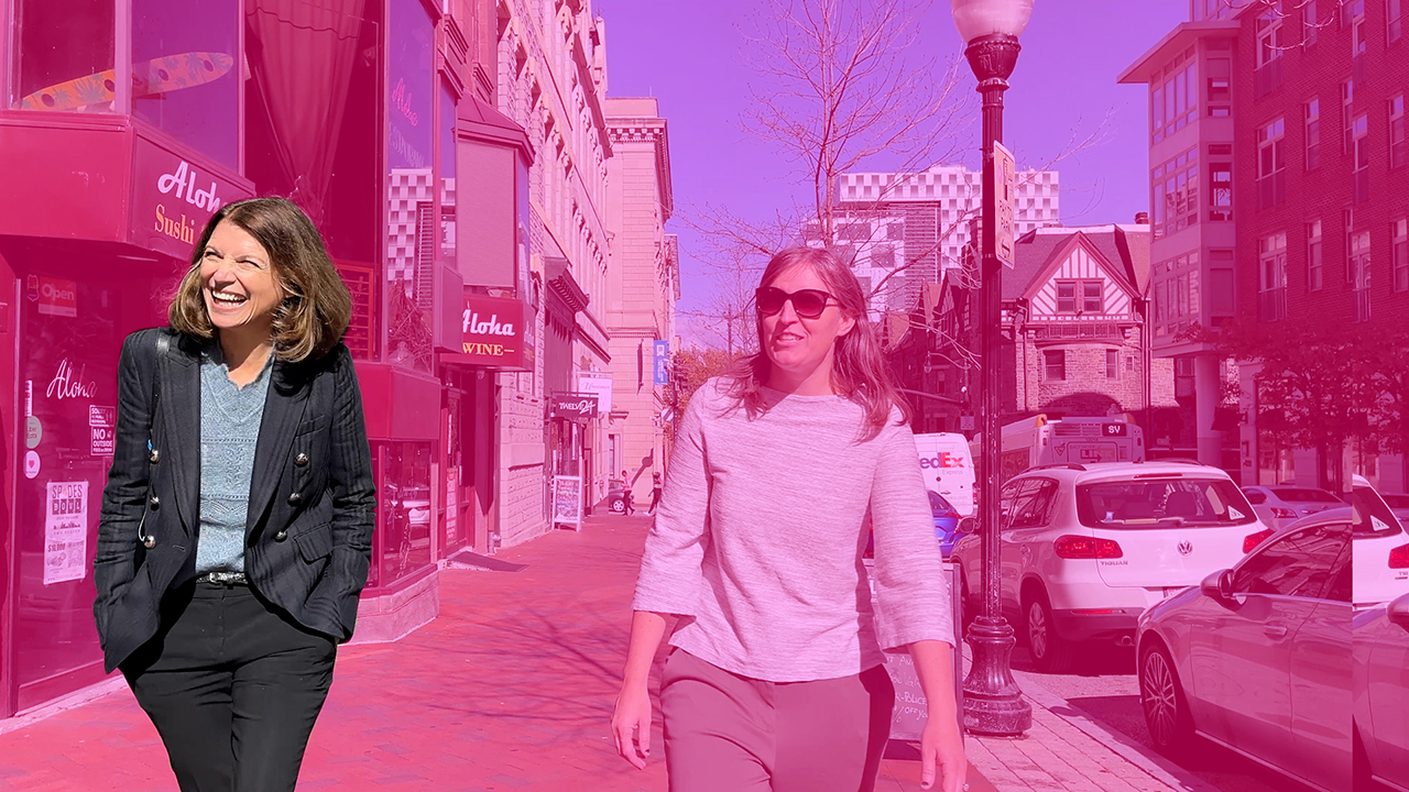 Seen laughing in a pink-washed photo, Jennica Larrison walks on a city street.