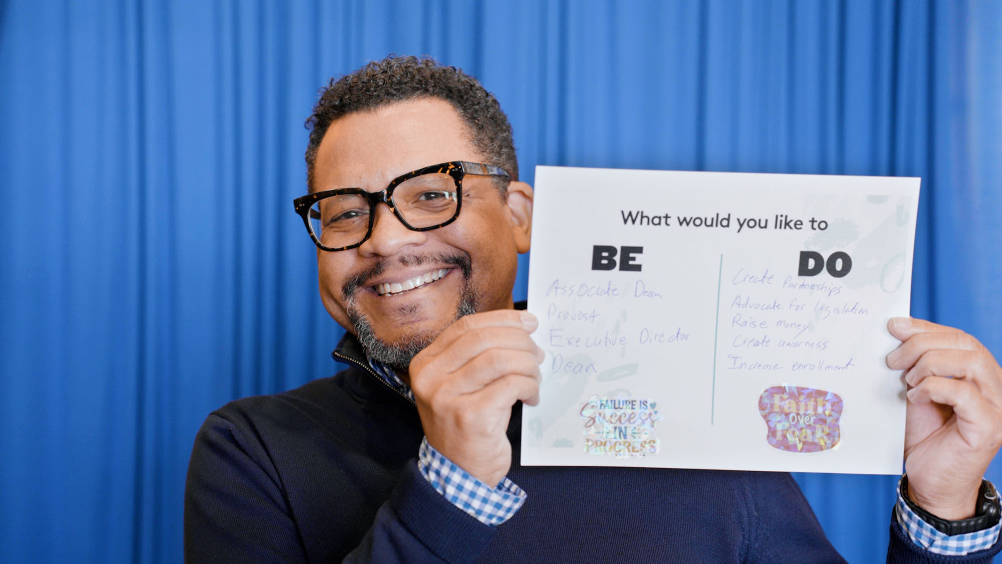 David Marshall holds a piece of paper on which he brainstormed what what wants to do vs. what he wants to be in the future.