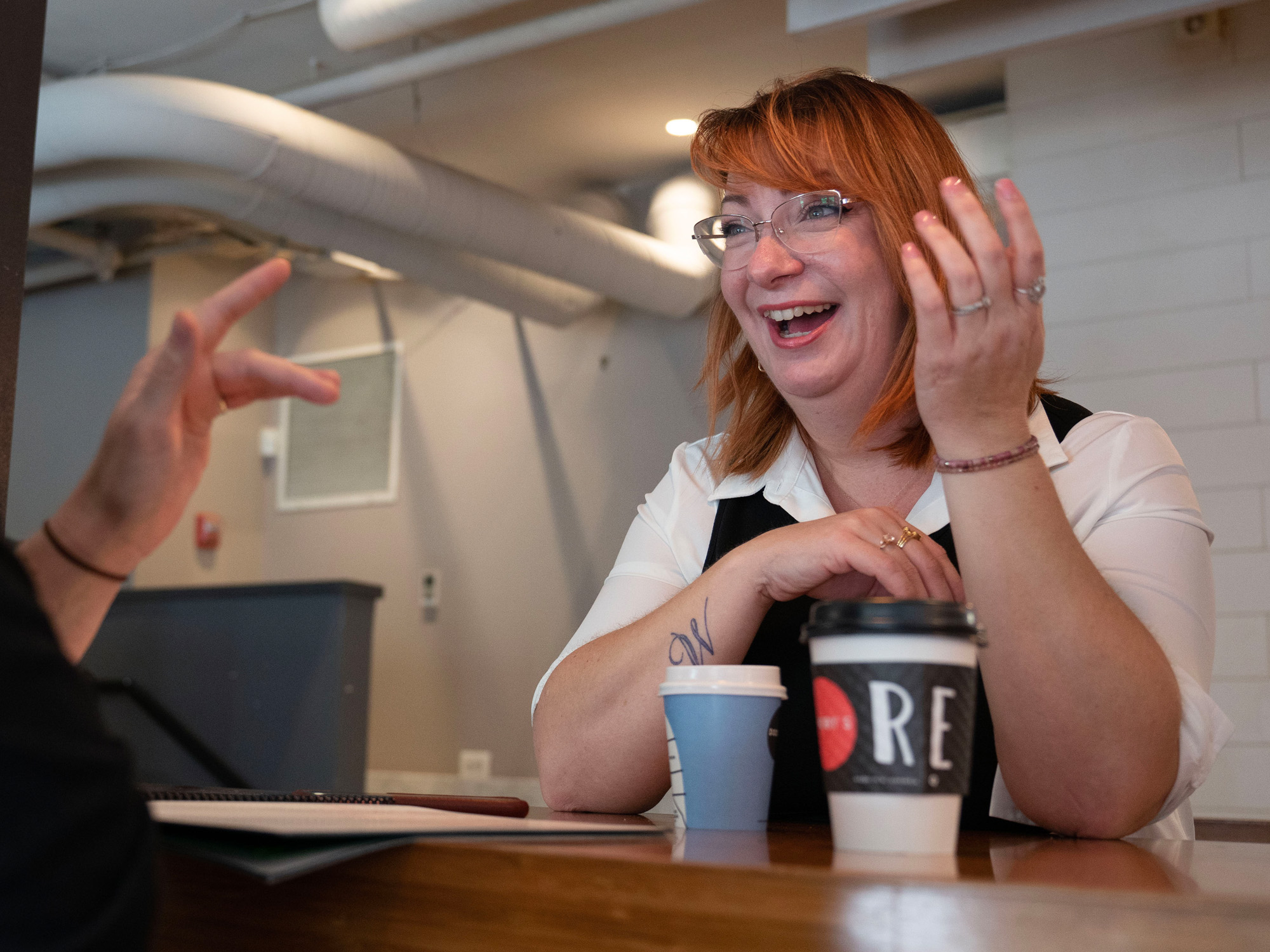 Dena Allen-Few holds a conversation over coffee.