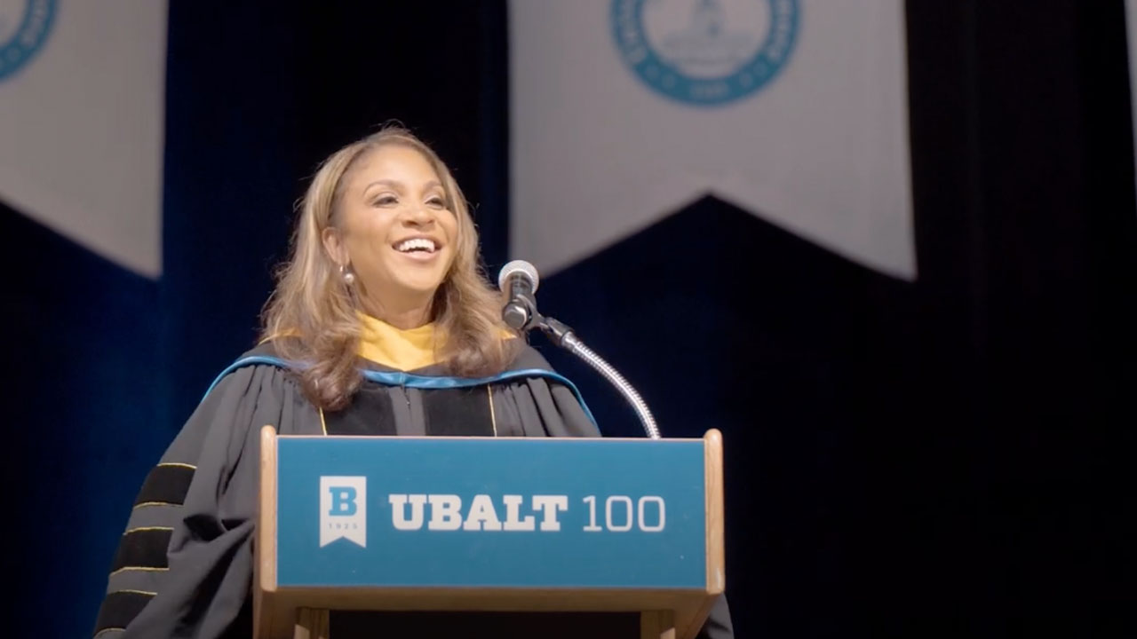 First Lady of Maryland addresses graduates from a stage podium