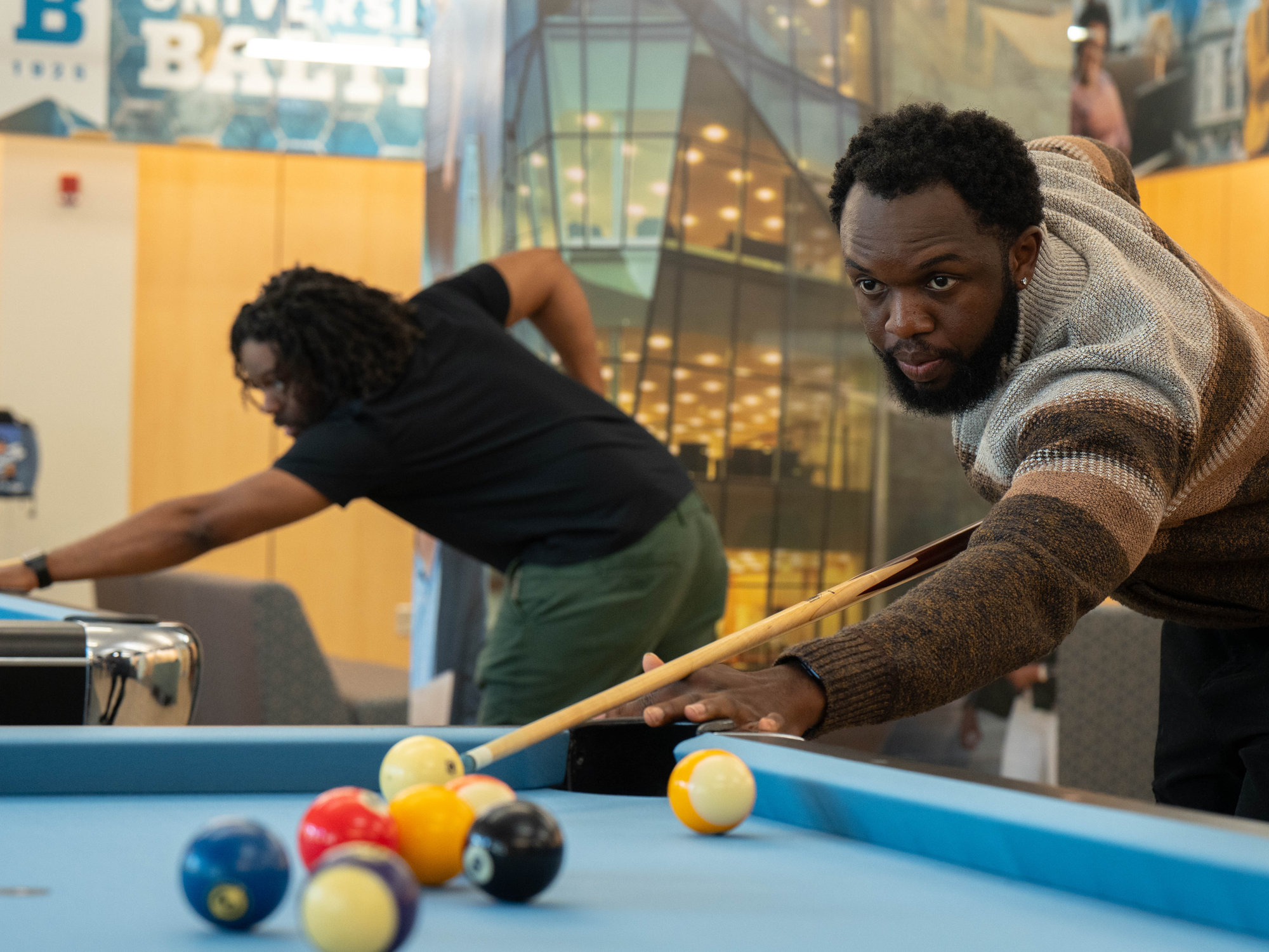 Students play pool