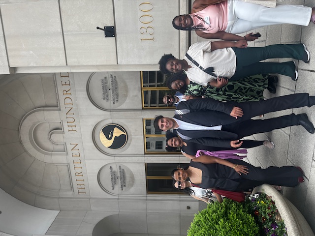 A student group poses outside the World Bank entrance.