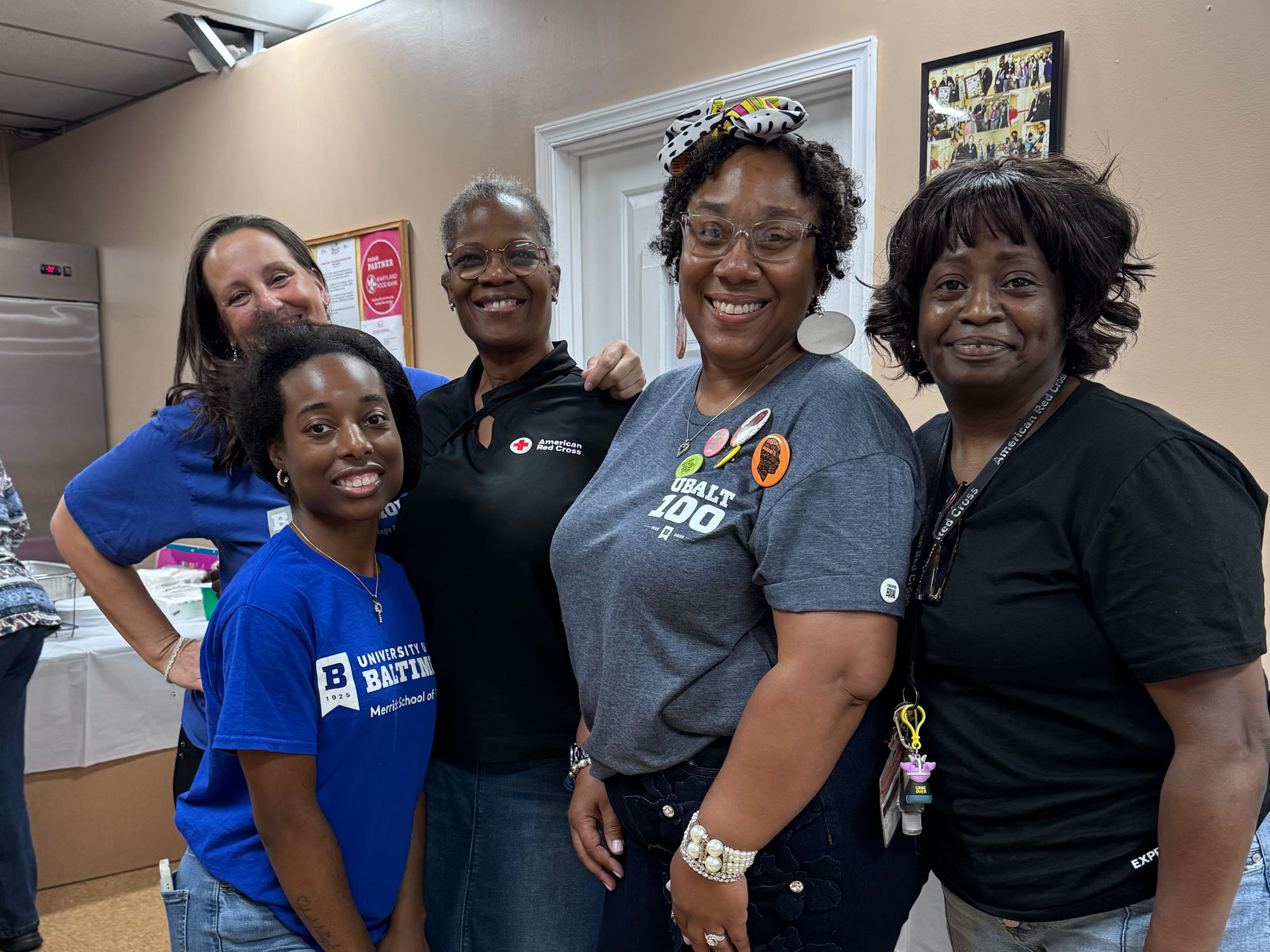 Students in the Human Services Administration senior seminar class pose for a photo on the day they hosted an event for Turner Station seniors. 