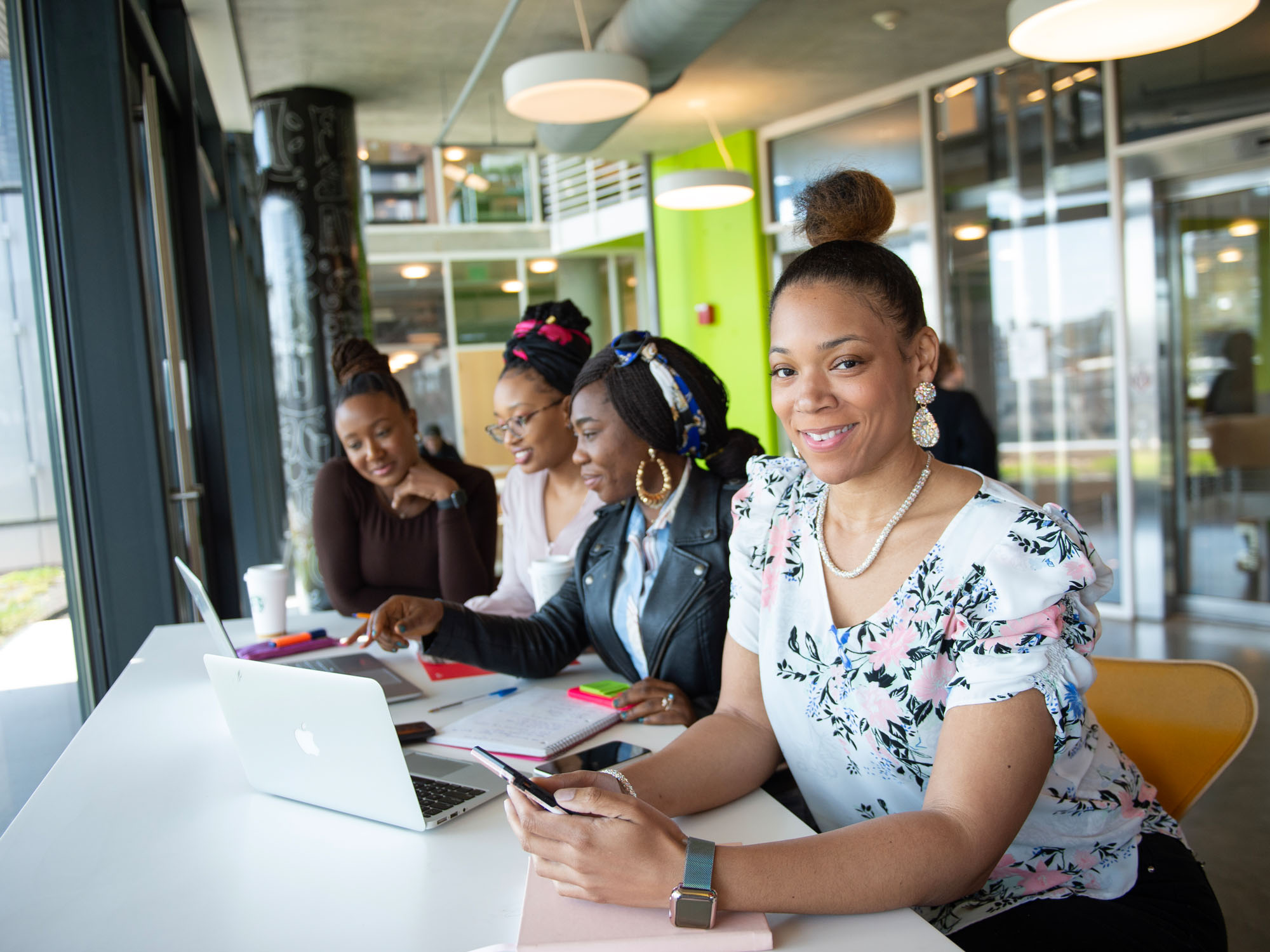 Loren Nelson sits in the cafe with other students. 