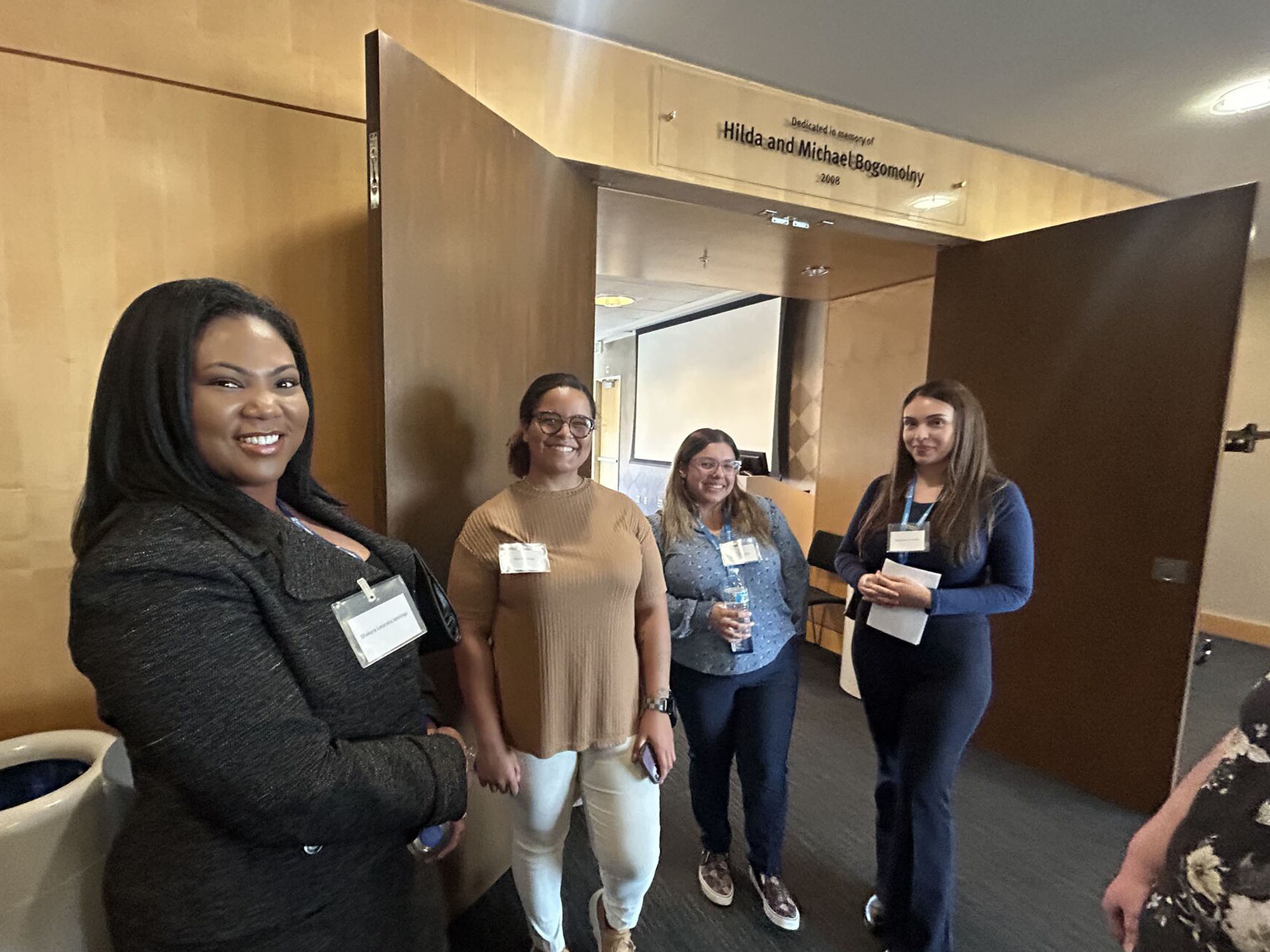 Students pose in the UBalt Student Center during a networking event. 
