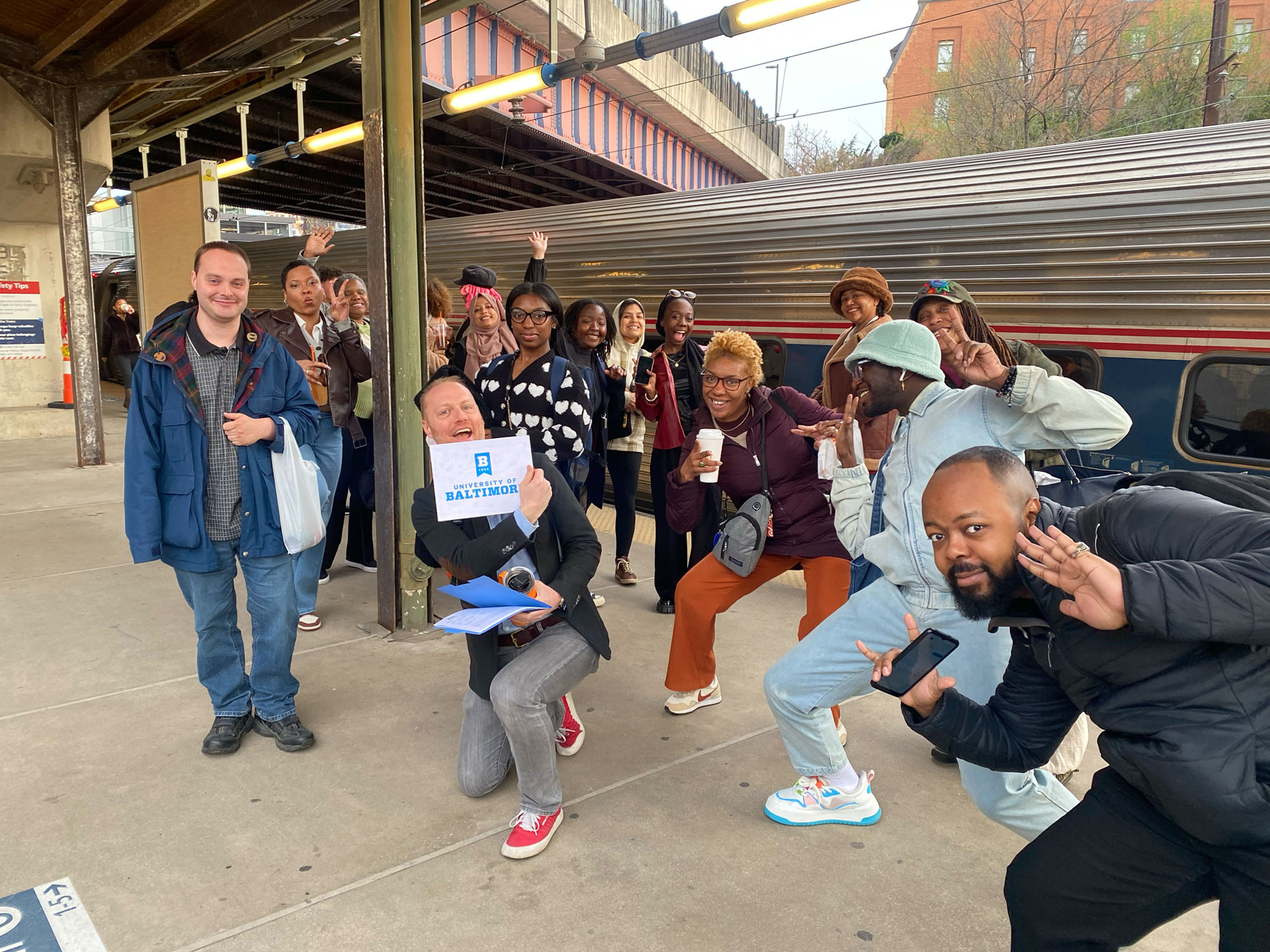 The group of students pose at a New York subway. 