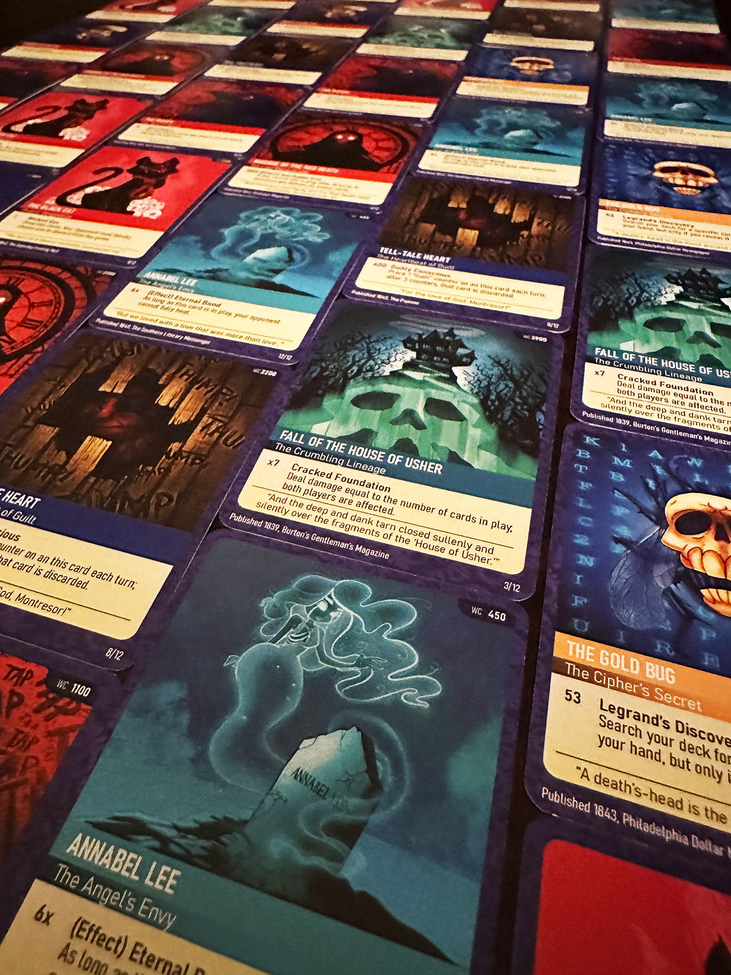 Rows of designed trading cards showing illustrations inspired by Edgar Allan Poe's works
