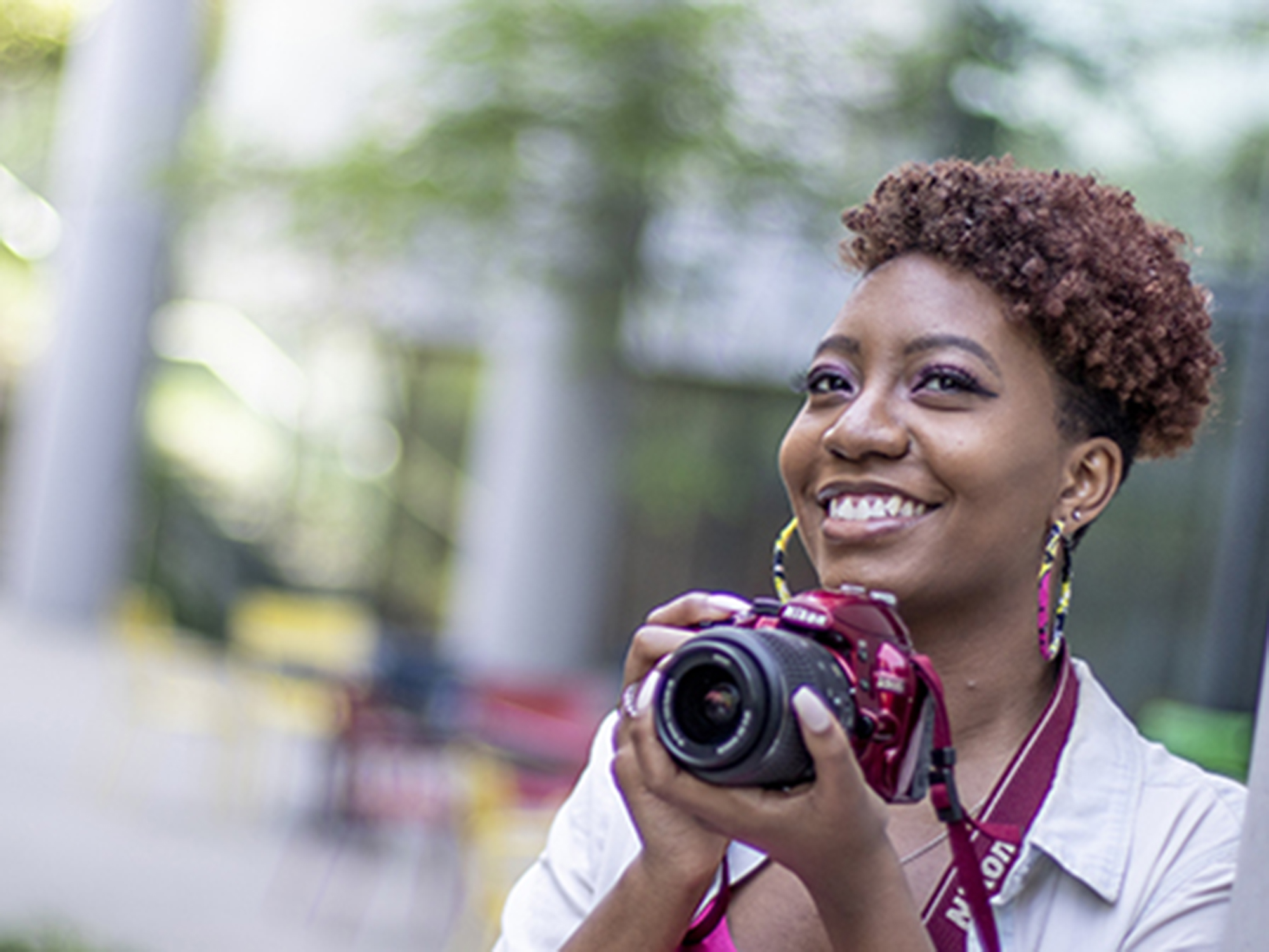 UBalt student smiles while taking photos