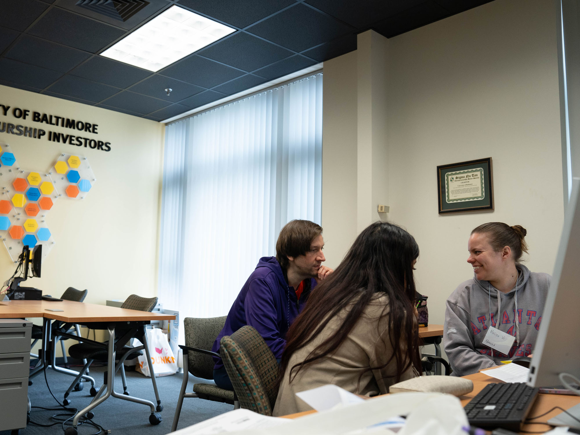 Students help a client with their taxes.