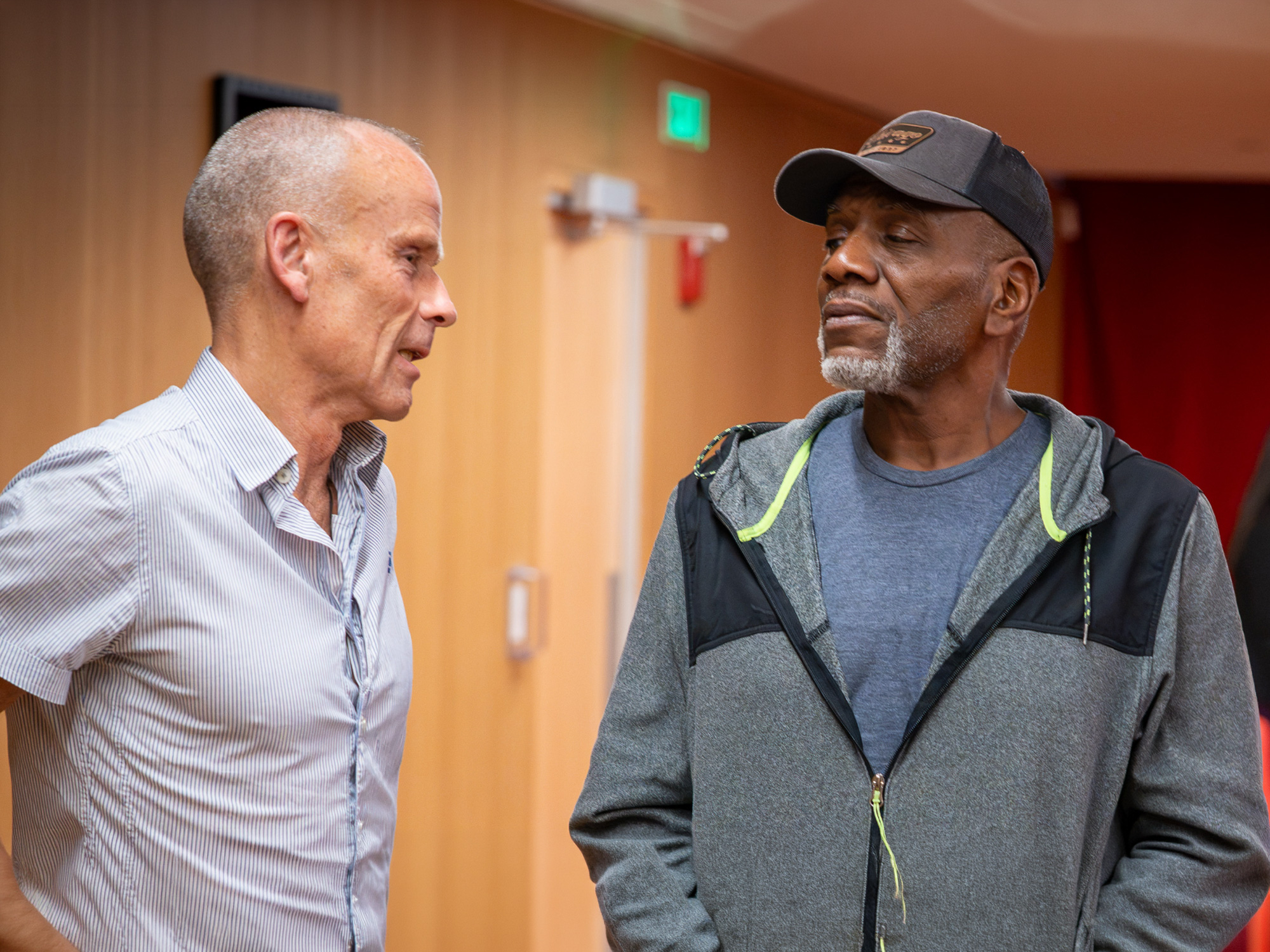 Two men speak with one another during the *Stolen Lives* screening and panel discussion at the University of Baltimore School of Law.