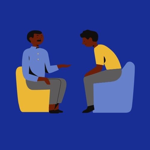 two people in chairs sitting across from each other