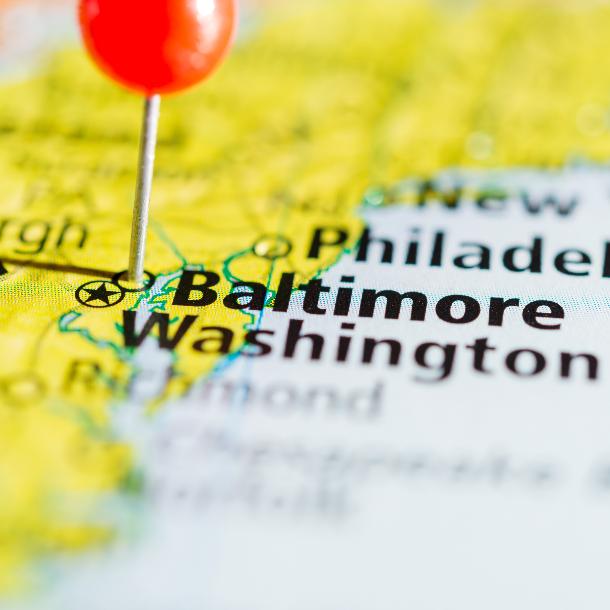 a grapnic representation of the a map of the East Coast of the U.S. with a red location pin  on the cith of Baltimore, Maryland