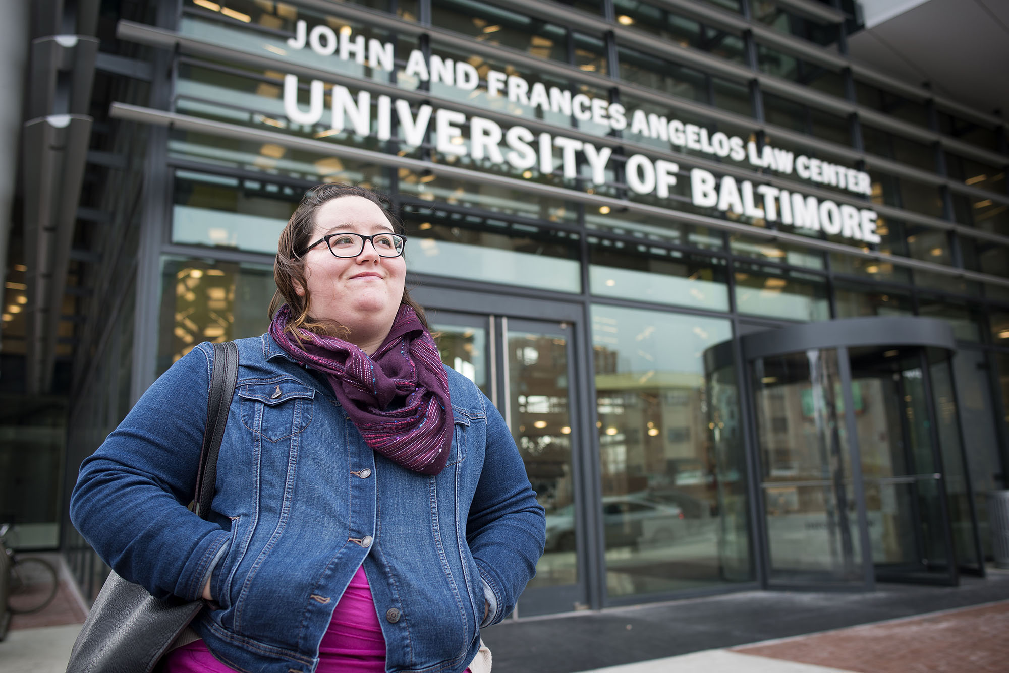 Smiling student outside of the John and Frances Angelos Law Center