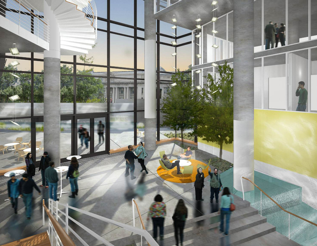 Bright, modern atrium with students gathering, studying, and moving through an open, collaborative space.