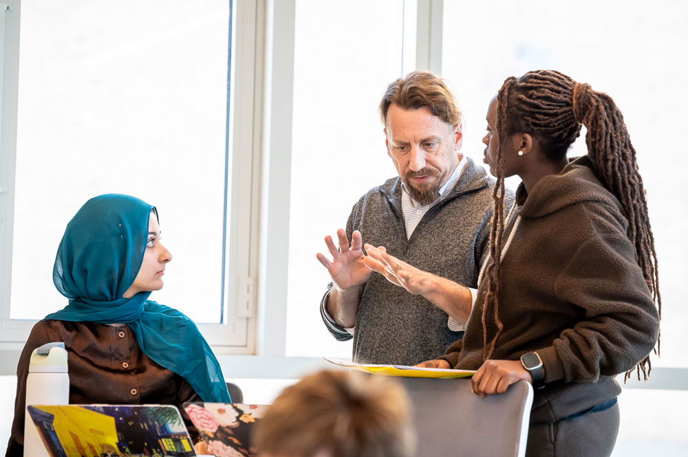 Law students and a professor engage in a classroom discussion.
