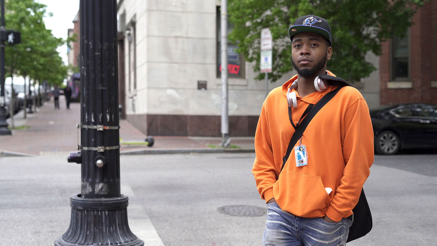 Demetrius walking to class in Baltimore city.