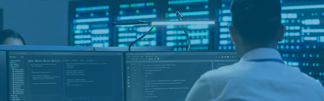 image of a man a computer desk