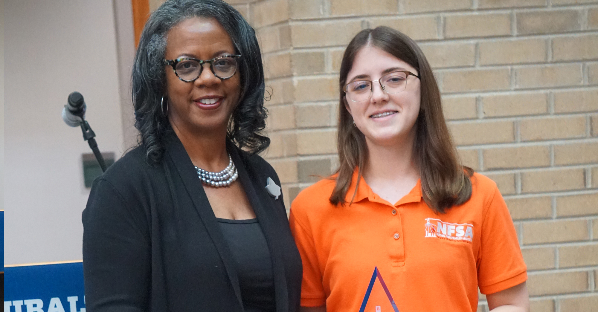 Katie Boettinger receiving the Mary Lou Hudson Award in Accounting from Dr. Jan Williams