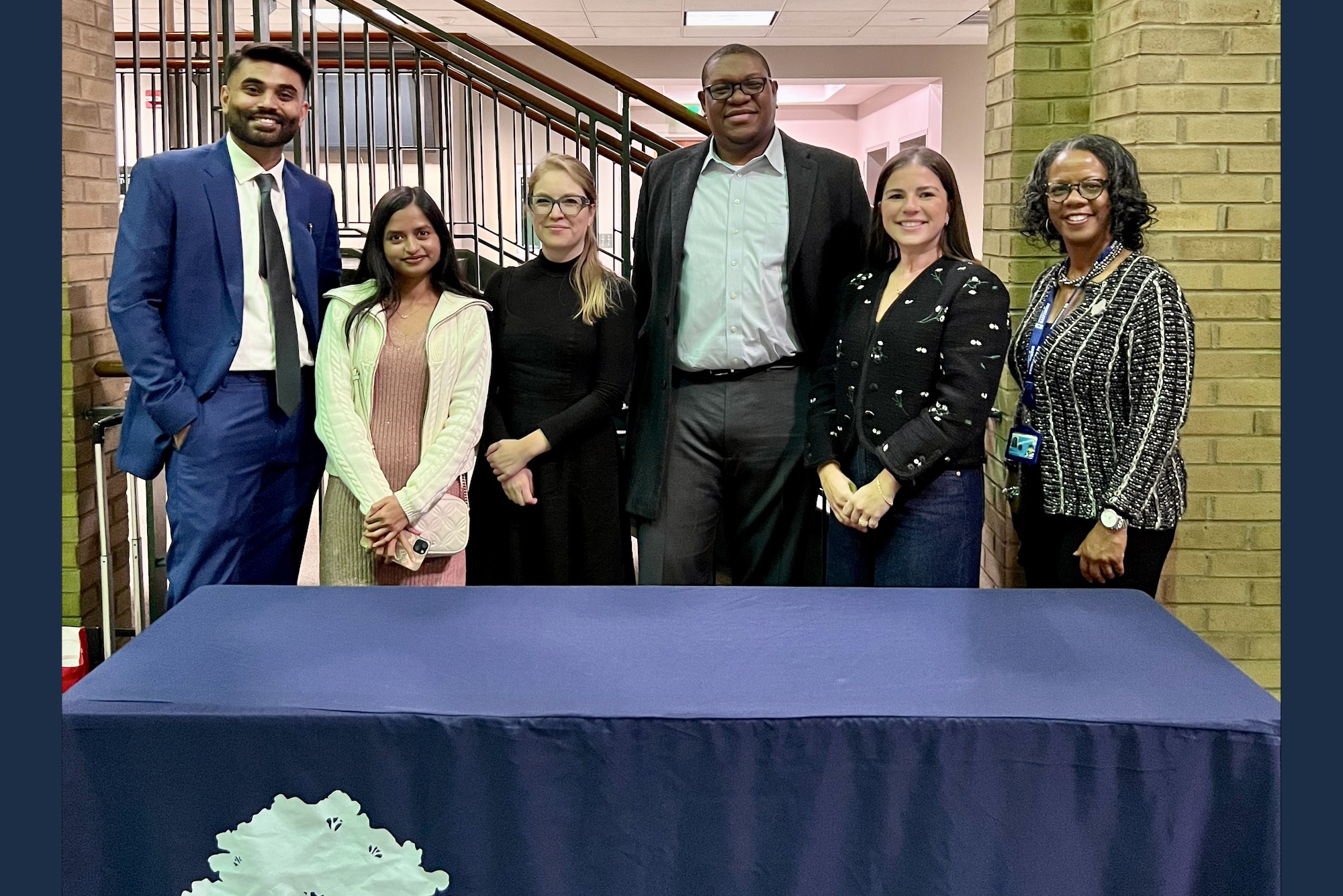 SB & Company team members pose with Jan Williams