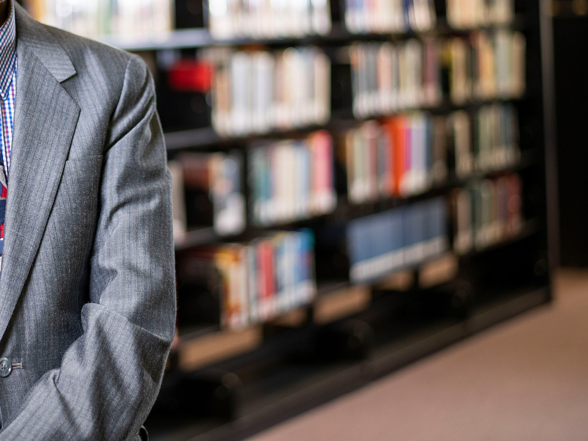 abstract image of a School of Business faculty in the Library stacks