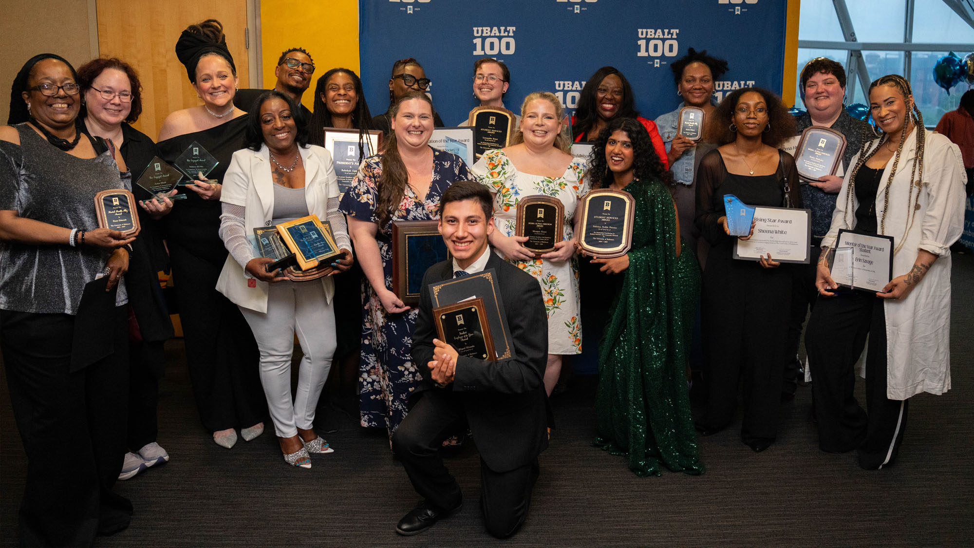 The event's winners pose with their awards.