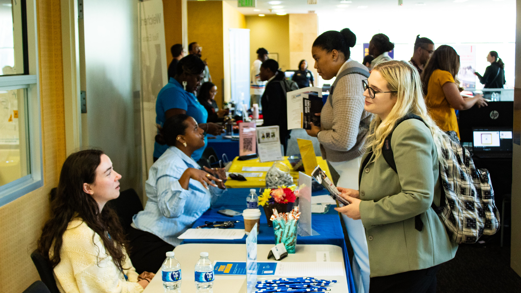 students speaking to employers at a career fair